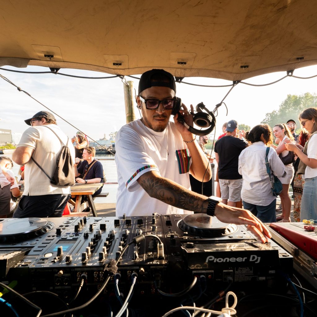 Micky Perú performing a dynamic DJ set in the Peruvian Independence Day area at Latin Food Experience.