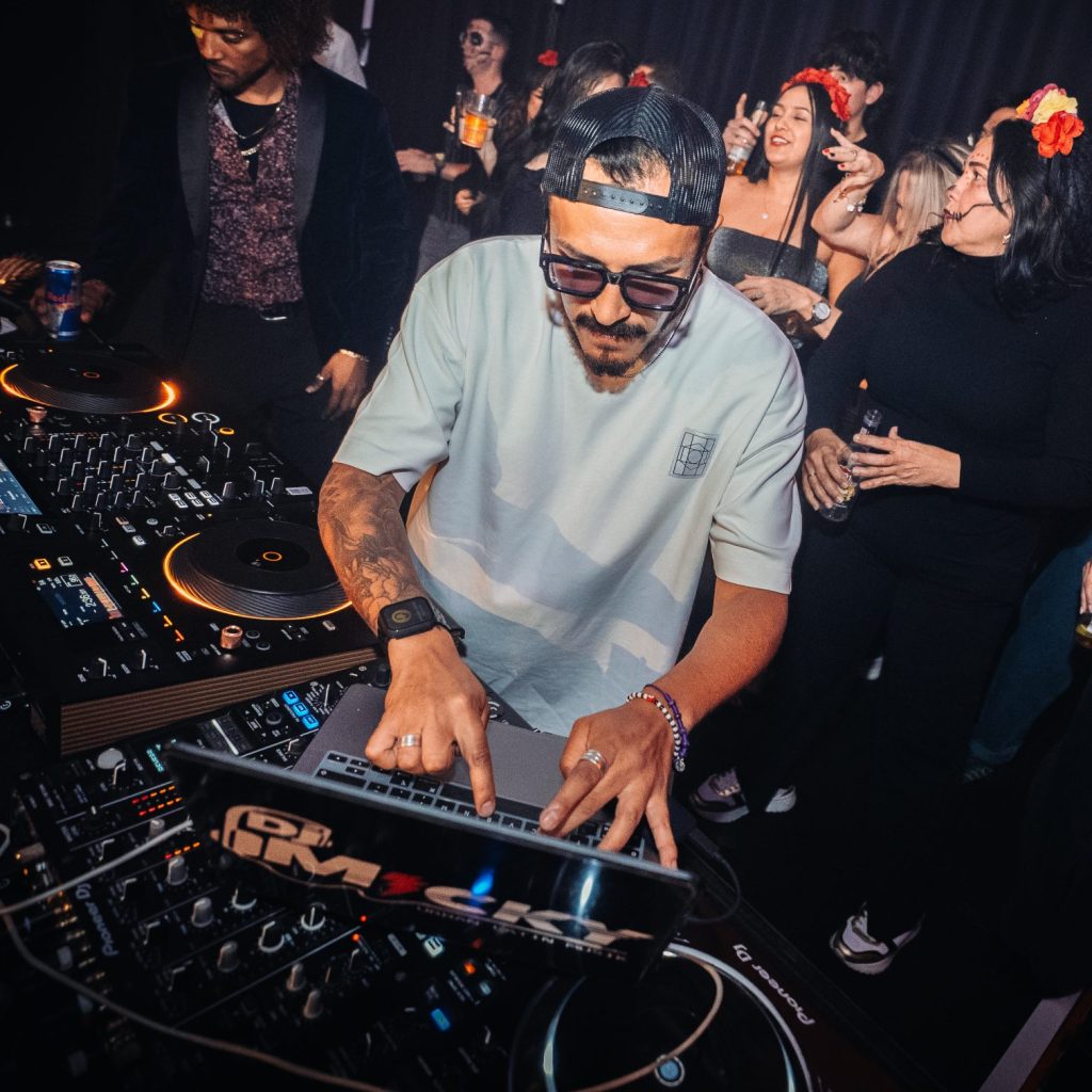 Micky Perú delivering an electrifying DJ set at The Latin Experience – A top Latin DJ in Europe.