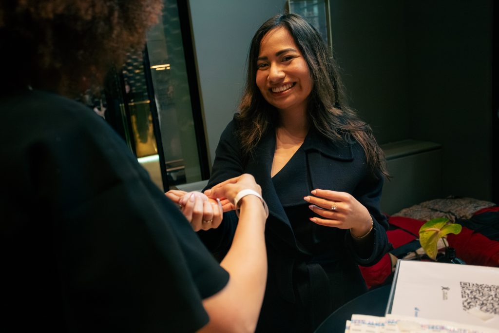 A TLX volunteer actively supporting the event at the W Amsterdam.