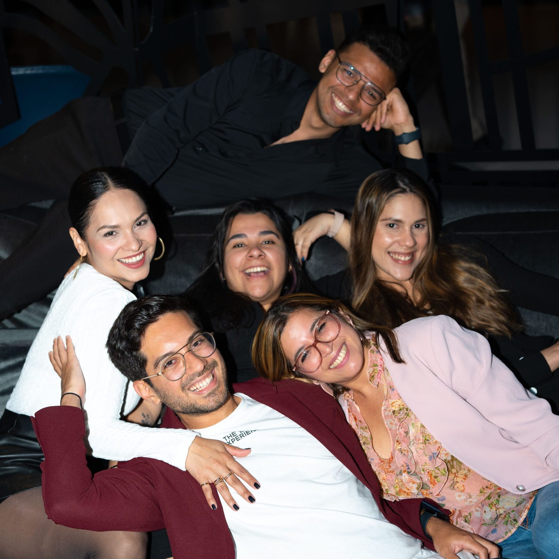 TLX team posing together, radiating friendship and unity.