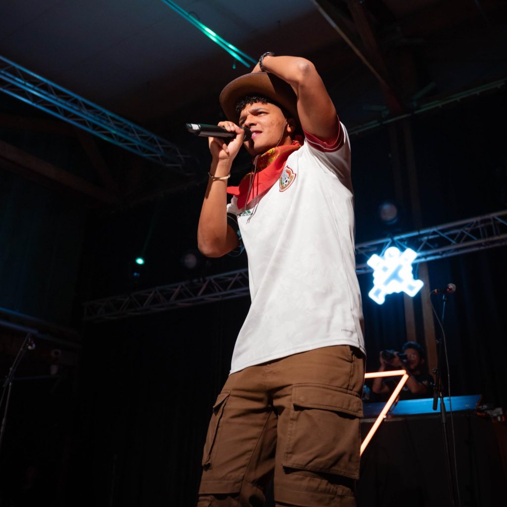 Leosscrew delivering a high-energy rap performance at The Mexican Experience in a prime-time show.